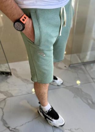Мужские удлиненные шорты с резинкой и шнурком в поясе с карманами3 фото