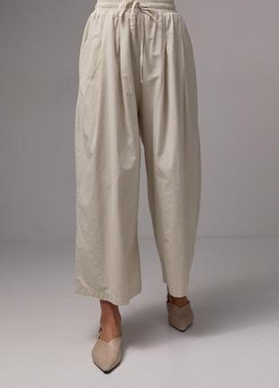 Жіночі трендові літні бежеві, укорочені широкі штани кюлоти літо m3 фото