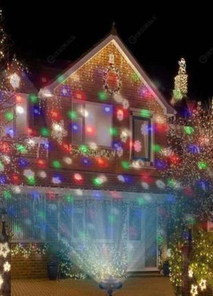 Лазерний проектор вуличний новорічний лазер на будинок 8097 фото