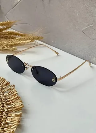 Женские овальные солнцезащитные очки в металлической оправе без ободка в цветах7 фото