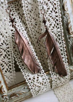 Серьги с перьями