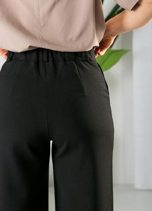 Черные молодежные брюки палаццо в деловом стиле больших размеров 42-549 фото