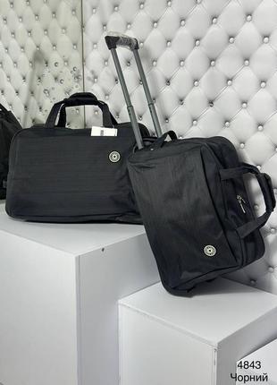 Женская мужская качественная дорожная сумка на колесах черная меньшая