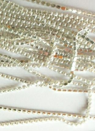Лента стразовая жемчужина белого цвета в серебристой оправе 2 мм2 фото