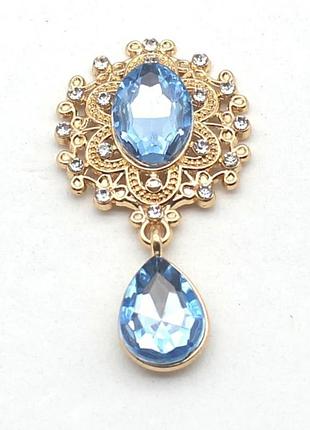 Камень с подвеской в ажурной золотистой оправе светло-синий 2,6*4,6 см
