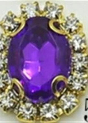 Камінь в золотистій оправі 2*1,5 см фіолетовий