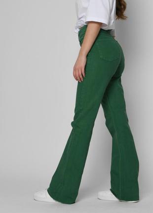 Зеленые джинсы эспаньолы - клеш7 фото