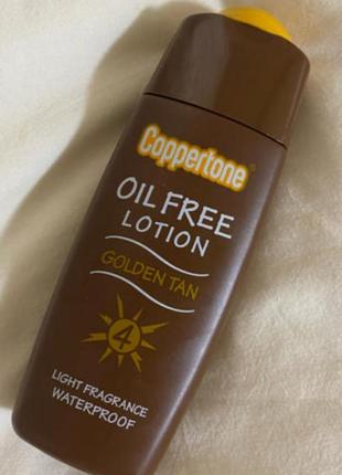 Безмасляный лосьон для загара coppertone golden tan oil free spf 4, 120 мл, япония1 фото