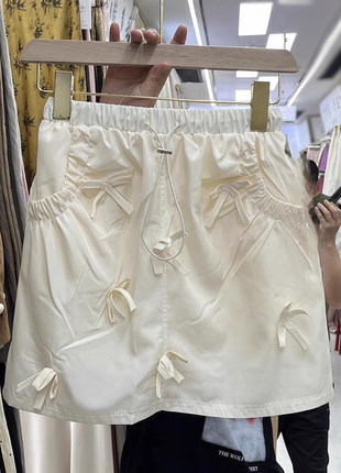 Короткая юбка мини с бантиками4 фото