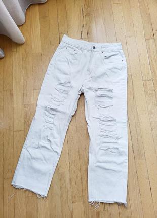 Білі жіночі прямі джинси з розрізами рванію вільні весняні