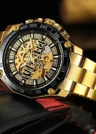 Мужские механические наручные часы скелетоны forsining 8186 gold-black с автоподзаводом.2 фото