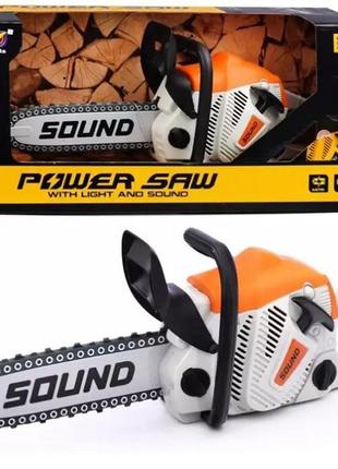 Іграшка бензопила гумова ланцюг обертається зі звуком гумання на батарейках