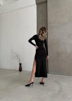 Облягаюча сукня міді, з розрізом на стегні, чорна9 фото
