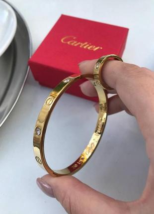 Брендовый набор cartier браслет и кольцо в позолоте с камушками4 фото