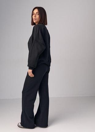 Трикотажний жіночий костюм з бомбером та прямими штанами - чорний колір, l (є розміри)2 фото