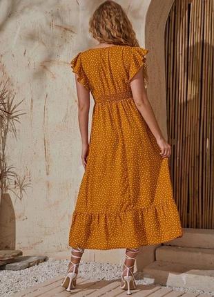 Витончена жовто-гаряча сукня6 фото