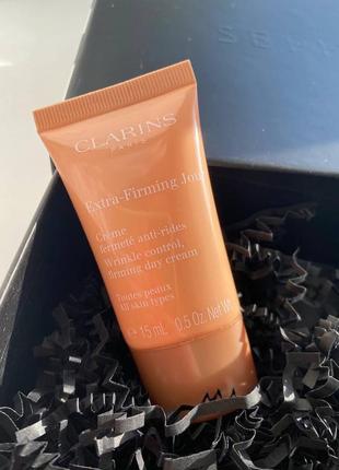 Антивіковий денний крем для пружності шкіри clarins extra firming jour проти зморшок1 фото