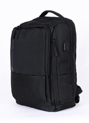 Чоловічий сучасний чорний міцний рюкзак з usb з кишенею під га...6 фото
