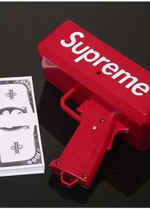 Пістолет який стріляє грошима supreme money gun6 фото