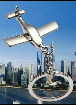 Сувенир брелок металл самолет путешествия серебристый обьемный как сталь