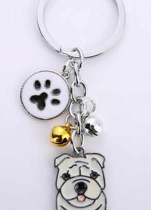 Брелок на ключи металл собака пес порода бежевый бульдог или стафф лапка2 фото