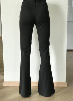Жіночі чорні штани кльош від коліна висока талія8 фото