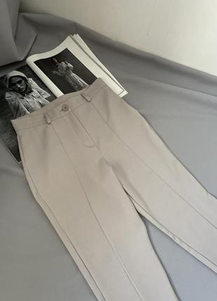 Сірі брюки з розрізами