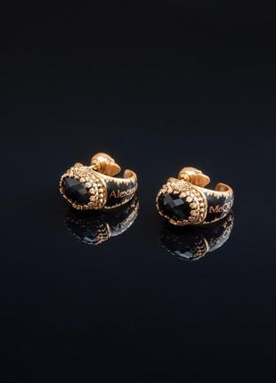 Сережки mcqueen чорний камінь золоті 029151