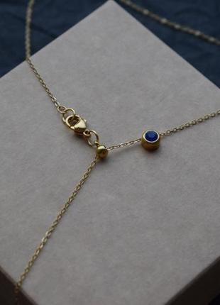 Золотистая цепочка с синим  кристаллом в стиле минимализм , кристалл на шею7 фото