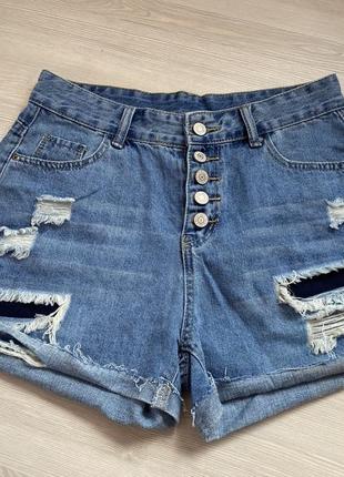 Актуальные джинсовые шорты, короткие, с рваностями, стильные, модные, трендовые2 фото