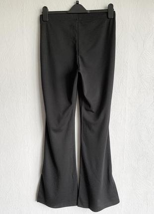 Трикотажні брюки кльош з розрізами6 фото