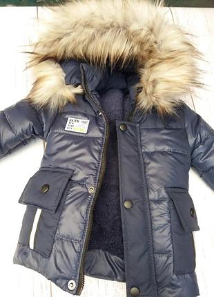 Крута подовжена куртка єврозима з нашитими карманами