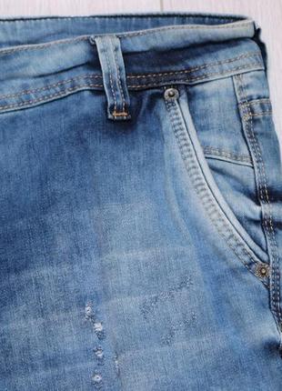 Шорти джинсові чоловічі сині з потертостями звужені на манж...3 фото