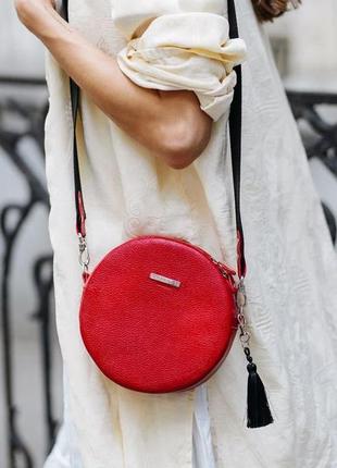 Жіноча шкіряна кругла сумка через плече крос-боді з натурально...8 фото