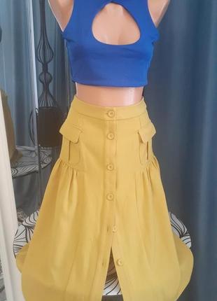 Желтая юбка с пуговицами2 фото