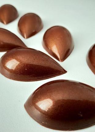 Корпусна шоколадна цукерка "лотос"1 фото