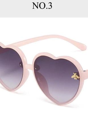 Стильні сонцезахисні рожеві дитячі окуляри серця3 фото