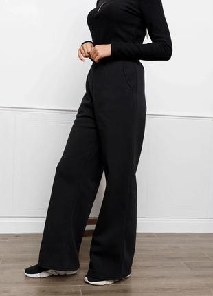 Чорні утеплені флісом широкі штани, розмір m2 фото