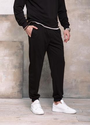 Чорні трикотажні спортивні штани з манжетами, розмір l2 фото
