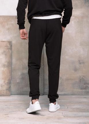 Чорні трикотажні спортивні штани з манжетами, розмір l3 фото