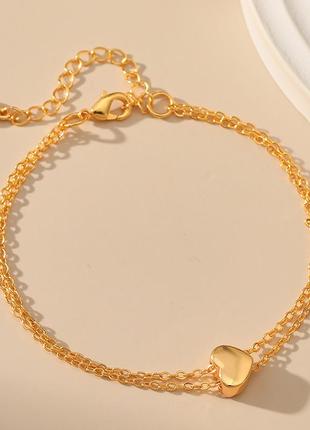 Золотой браслет с сердечком из нержавеющей стали с позолотой 18к2 фото