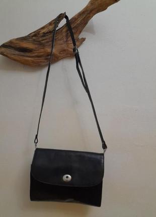 Кожаная сумка-клатч от claudio ferrici.1 фото