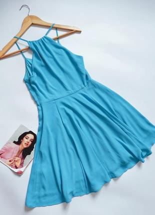 Жіноча блакитна сукня міді без рукавів приталене на блискавці-неведимці збоку  від бренду express5 фото