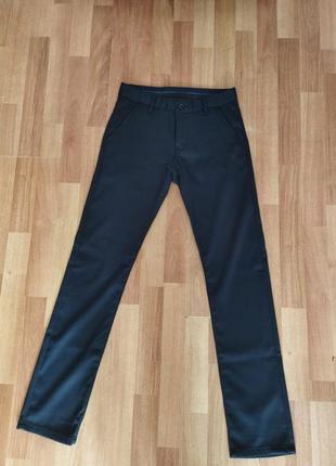 Новые брюки на подростка темно - синего цвета1 фото