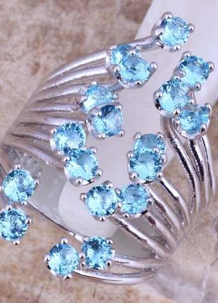 Кольцо с голубыми топазами.925 проба