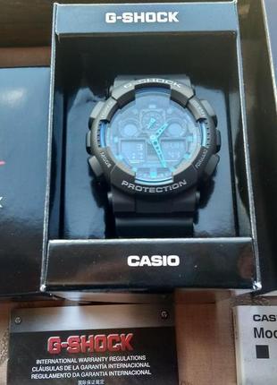 Годинник casio g-shock ga-100-1a2 чорні з синіми вставками нові1 фото