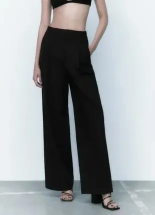 Стильные черные широкие брюки1 фото