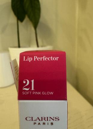 Зволожувальний блиск для губ clarins natural lip perfector6 фото