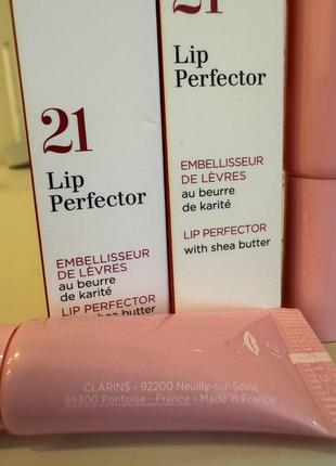 Зволожувальний блиск для губ clarins natural lip perfector2 фото