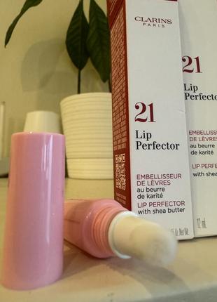 Зволожувальний блиск для губ clarins natural lip perfector3 фото